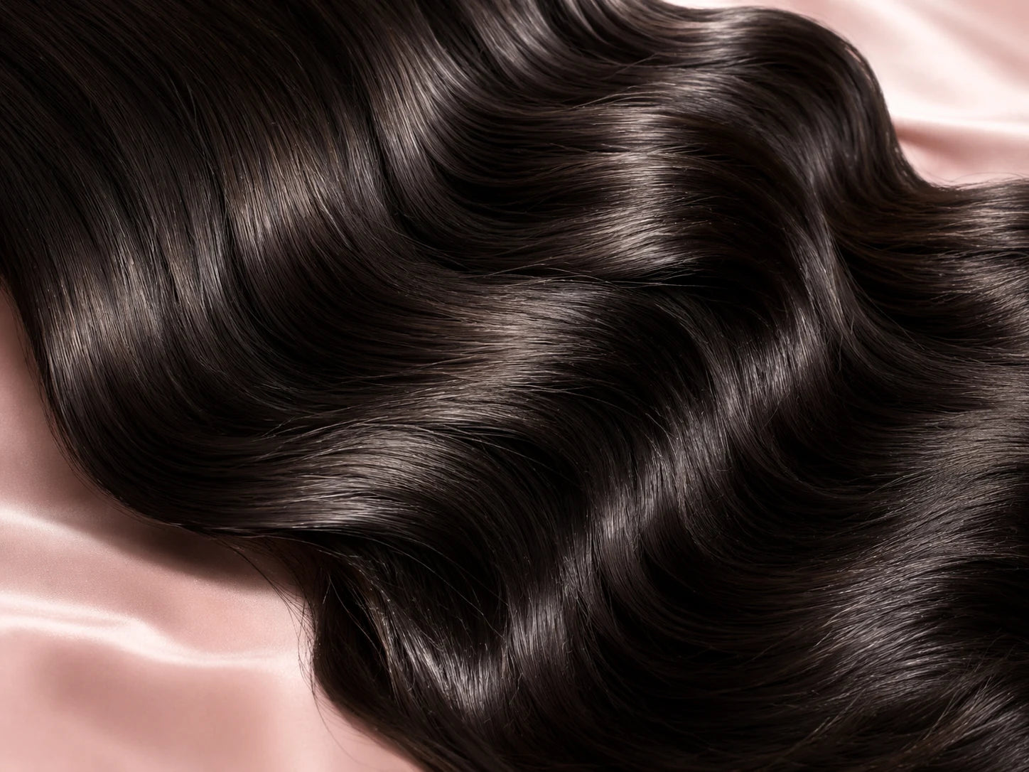 Close-up of glossy natural black human hair texture